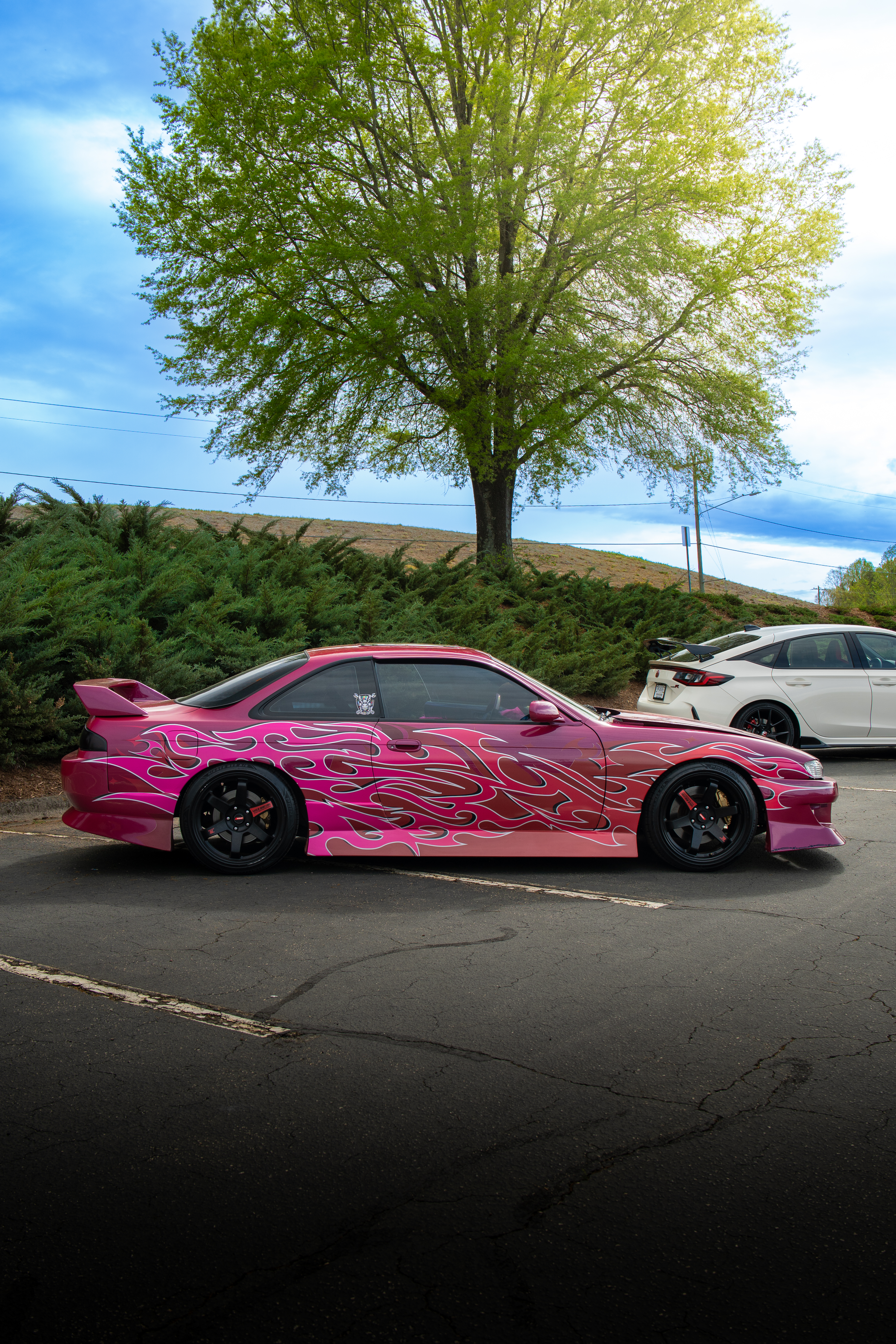 Pink flame-wrap Nissan S14 side profile