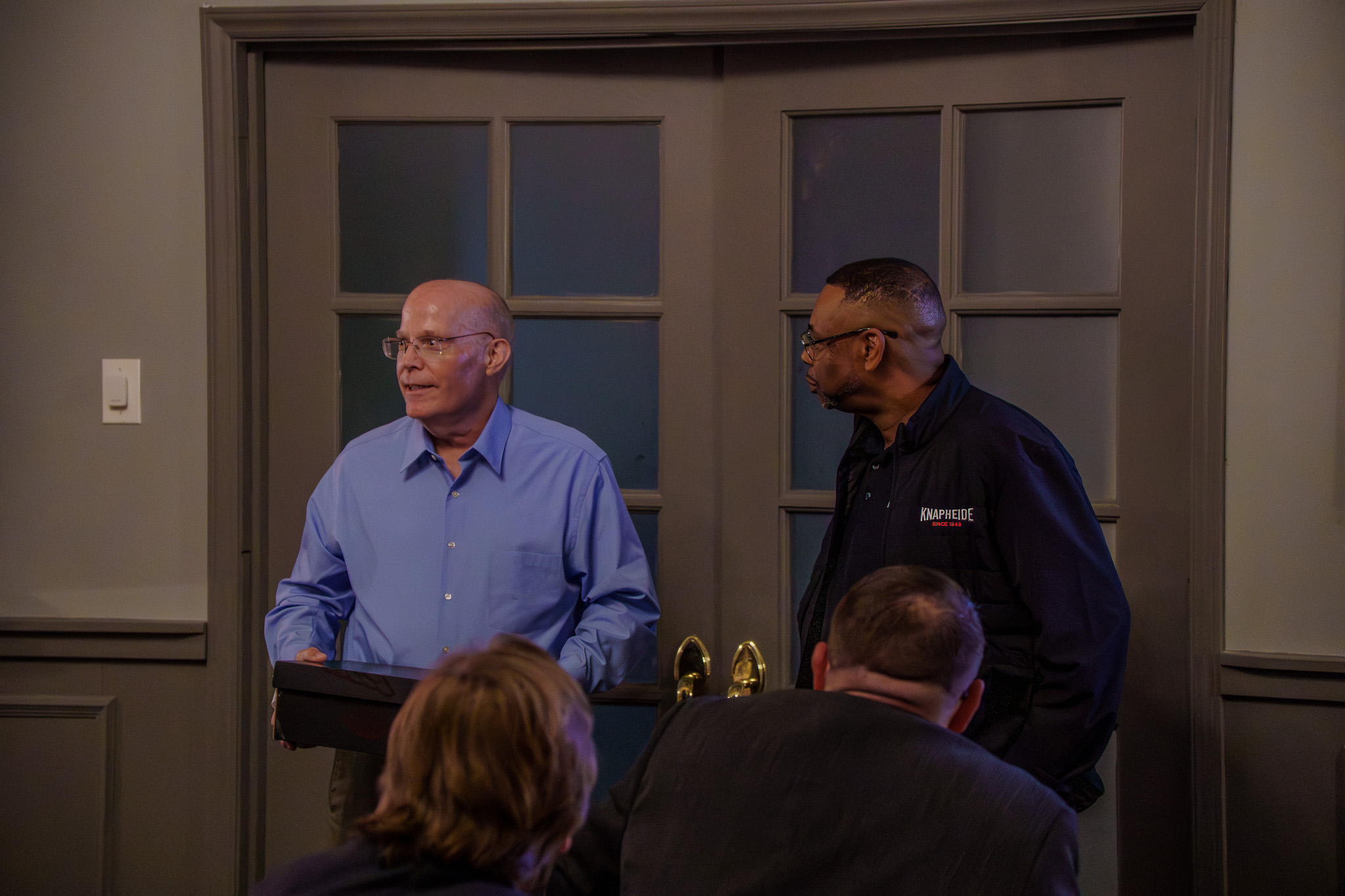Candid conversation between retirement party guests