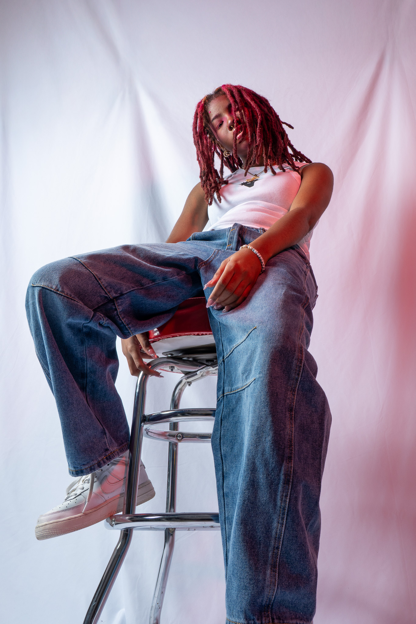 Model portrait with colored gel lighting for a denim brand shoot